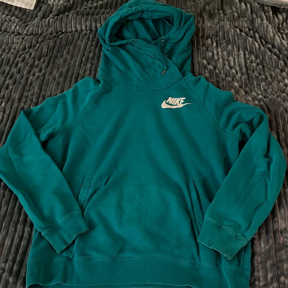 Teal Nike Hoodie a lil wear and tear but still a great hoodie and comfy as heck